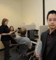 Jason Chan (right), an assistant professor of psychology at ISU, oversees an eyewitness memory experiment being administered by his graduate research assistant Jessica LaPaglia (standing left).