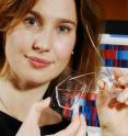 Melissa Kemp, an assistant professor in the Wallace H. Coulter Department of Biomedical Engineering at Georgia Tech and Emory University, shows the microfluidic device for sample handling that allowed a statistical model to be generated to evaluate T cell responsiveness and accurately predict cell age and quality.