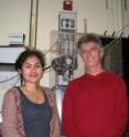 Annia Rodriguez and John Perona stand in front of the Rapid Quench Flow Machine used in the experiments.