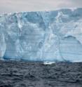 The exposed portion of an iceberg in the Weddell Sea rises 30 to 40 meters (98 to 131 feet) above the sea surface.  Overhanging icicles result from thawing and freezing of the surface of the iceberg.