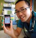 Dr. Daniel Low with the free iResus application, developed to help doctors respond in a cardiac emergency.