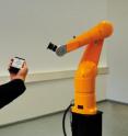 The robotic arm can be controlled with an input device. When the hand holding the device is moved, the robot emulates the movement.
