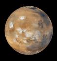 Mars measures approximately 6,794 kilometers (4,221 miles) in diameter. Earth, with a diameter of 12,750 kilometers (7,926 miles) grew to almost twice the size of Mars via collisions with smaller planetary embryos. Mars is a planetary embryo that escaped such collisions, scientists report in the May 25, 2011, issue of the journal <i>Nature</i>.