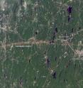 This is a Landsat 5 satellite image of the area between Springfield and Sturbridge, Mass. taken on June 5, 2011, that clearly shows the light-colored tornado track.