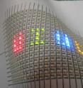 This is a flexible array of LEDs mounted on paper. Hand-drawn silver ink lines form the interconnects between the LEDs.