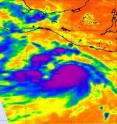 This infrared image of Tropical Storm Dora was captured from the AIRS instrument on NASA's Aqua satellite on July 18, 2011 at 1929 UTC (3:29 p.m. EDT/12:29 PDT) and it revealed a large area of very cold cloud top temperatures (purple) on strong thunderstorms surrounding the center.