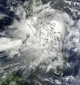 This visible image of Tropical Storm 10W, now called Nock-ten, was captured on July 26, 2011 at 02:30 UTC (July 25 at 10:30 p.m. EDT) as its center was moving over the Philippines. The image was taken from the Moderate Resolution Imaging Spectroradiometer (MODIS) that flies on NASA's Terra satellite (it also flies on NASA's Aqua satellite).
