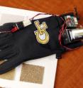 Georgia Tech researchers have developed a glove with a vibrating fingertip that improves tactile sensitivity and motor performance. The device uses an actuator made of a stack of lead zirconate titanate layers to generate high-frequency vibration to the side of the fingertip.