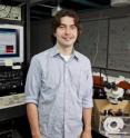 Maurice Ayache, a Ph.D. candidate in electrical engineering at UC San Diego, uses a near-field scanning optical microscope to measure variations in a light beam, proving that the team's waveguide device worked.