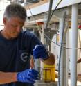 This is Craig Carlson at sea, sampling ocean water.