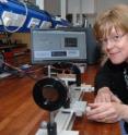 Professor Pam Thomas, University of Warwick, with the device a Zero-Birefringence Optical Temperature Sensor (Z-BotS).
