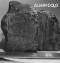 The meteorite called ALH84001 is sliced to show its interior. Found in the Allan Hills ice field in Antarctica in 1984, the four-billion-year-old rock is one of the oldest in the world. The meteorite likely originated just below the surface of Mars. About 16 million years ago, another meteorite struck the area, blasting it off into space before it landed on Earth about 13,000 years ago.