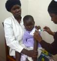 A child receives a vaccination at the UNC study site, George Joaki Centre in Lilongwe, Malawi.