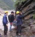 Charles Henderson (middle) of the University of Calgary collects material from a sedimentary layer in Shangsi, Sichuan Province, China. This was one of more important sections studied for ash layers and marine fossils used to pinpoint the dates and rate of Earth's massive extinction.