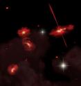 This artist's conception portrays four extremely red galaxies that lie almost 13 billion light-years from Earth. Discovered using the Spitzer Space Telescope, these galaxies appear to be physically associated and may be interacting. One galaxy shows signs of an active galactic nucleus, shown here as twin jets streaming out from a central black hole.