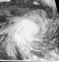 The MODIS instrument on NASA's Aqua satellite captured an image of Tropical Cyclone 01S on Dec. 5 at 08:18 UTC (3:18 a.m. EST) in the Southern Indian Ocean. Strong thunderstorms are visible around the center as they cast shadows on the lower surrounding clouds.