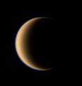 Titan is covered in a thick, methane-dominated atmosphere.