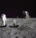 This is Buzz Aldrin placing a seismometer on the moon during the Apollo 11 mission.