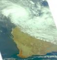 When NASA's Aqua satellite passed over Tropical Cyclone Lau on March 16 at 0553 UTC it captured this visible image of the storm approaching the Pilbara coast.