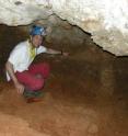 This image shows Rolf Quam, a Binghamton University anthropologist, in the Valdegoba cave indicating where the Neandertal mandible came from in the stratigraphy.