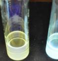 Pictured is a vial holding original white-light quantum dots on the left and a vial holding the enhanced quantum dots on the right.