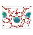 This is an example of the 50 best zeolite structures for capturing carbon dioxide. Zeolite is a porous solid made of silicon dioxide, or quartz. In the model, the red balls are oxygen, the tan balls are silicon. The blue-green area is where carbon dioxide prefers to adsorb.