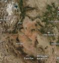 NASA's Aqua satellite picked up smoke (light brown) and hot spots (red) from fires in Colorado, Nevada, Arizona and New Mexico. This image was taken from the MODIS instrument onboard Aqua on June 19, 2012, at 2025 UTC (4:25 p.m. EDT).