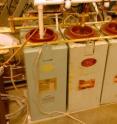 Four capacitors supply up to 10,000 volts of energy to separate the xenon electrons from their nuclei, creating an electrically charged plasma. Four capacitors supply up to 10,000 volts of energy to separate the xenon electrons from their nuclei, creating an electrically charged plasma.