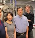 University of Georgia researchers, left to right, Yao-Wen Huang, Jing Chen, Yiping Zhao and Justin Abell stand in front of an electron beam evaporator at the UGA Nanoscale Science and Engineering Center. The instrument, designed and created by the UGA Instrument Shop, is used to deposit silver nanorods 1,000 times finer than the width of a human hair on a chip that can be used to detect viruses, bacteria and chemical contaminants.