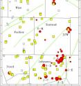 This is a map showing earthquake epicenters determined in this study (red circles), injection wells (squares and + symbols) in use since October 2006, seismograph stations (white triangles), and mapped faults (green lines. Circle sizes indicate quality of epicentral location, with large, medium and small sizes indicating qualities A, B, and C.  For injection wells, yellow squares are wells with maximum monthly injection rates exceeding 150,000 barrels of water per month (BWPM); white squares, exceeding 15,000 BWPM; + symbols, exceeding 1,500 BWPM.