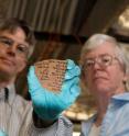 Brian Muhs and Janet Johnson, researchers at the University of Chicago's Oriental Institute, display a pottery piece with Demotic writing.