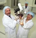 Team leader David Jamieson (left) with Changyi Yang in the CQC2T cleanrooms at the University of Melbourne with the special quantum computer device chip holder ready to be loaded into the ion implantation system.