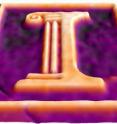 This is a three-dimensional image of the University of Illinois logo etched into a gallium-arsenide semiconductor, taken during etching with a new microscopy technique that monitors the etching process on the nanometer scale. The height difference between the orange and purple regions is approximately 250 nanometers.