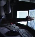 Matthew Kramer, scientist at the US Department of Energy's Ames Laboratory, examines data produced by transmission electron microscopy. Kramer and his team have been able to show the underlying order in metallic glasses.