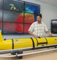 Matthew Oliver, assistant professor of oceanography at the University of Delaware, is using an underwater robot to help track sharks equipped with acoustic tags along the Delmarva Peninsula.