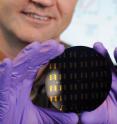 Georgia Tech Professor Clifford Henderson holds a wafer containing graphene p-n junctions.