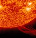 A solar prominence erupts into the sun's atmosphere, or corona.