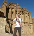 This image shows Christian Cloke, University of Cincinnati doctoral student, in front of the Monastery of Al Dier at Petra.