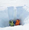 This shows atmospheric scientists Sarah Doherty (left) and Stephen Warren (right) taking snow samples in Greenland in summer 2010.