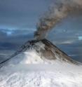A new study led by the University of Colorado Boulder indicates emissions from moderate volcanoes around the world, like the Augustine Volcano in Alaska, shown here, can mask some of the effects of global warming.