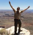UC's Ryan Washam looks out over the Grand Canyon while conducting research in the area.