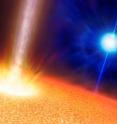 An artist's impression of the stars creating gamma-ray bursts. The background blue star is the progenitor of a standard long duration gamma-ray burst. A so-called Wolf-Rayet star, it has a mass ten or more times the mass of the sun but has a comparable size. The foreground star is the suggested progenitor of an ultra-long gamma-ray burst (GRB). It has a mass of perhaps 20 times the sun but is up to a thousand times larger. In both cases the GRB is produced by a jet punching through the star, but in the case of the ultra-long GRBs the much larger size of the star creates a much longer lived jet. 
Image copyright Mark A. Garlick, used with permission by the University of Warwick
