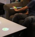 Carnegie Mellon University researchers have developed a depth camera/projector system that enables people to create computer interfaces on everyday surface using hand gestures.