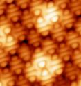 These are topographic STM images of a TCNQ monolayer on graphene/Ru.