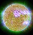 This photograph shows our sun on June 7, 2011, at the time of an eruption. The source of the eruption glows brightly at lower right. Material blasted outward only to fall back onto the sun's surface. By studying this process, astronomers gained new insights into how young stars grow via stellar accretion. This photo was taken by NASA's Solar Dynamics Observatory. Red shows light at a wavelength of 304 Angstroms, green is 171 Angstroms, and blue is 335 Angstroms.