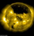 The European Space Agency/NASA Solar and Heliospheric Observatory, or SOHO, captured this image of a gigantic coronal hole hovering over the sun's north pole on July 18, 2013, at 9:06 a.m. EDT.