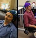 University of Washington researcher Rajesh Rao, left, plays a computer game with his mind. Across campus, researcher Andrea Stocco, right, wears a magnetic stimulation coil over the left motor cortex region of his brain. Stocco's right index finger moved involuntarily to hit the "fire" button as part of the first human brain-to-brain interface demonstration.