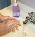 A person washes their hands with an antibacterial soap.