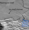 The ice shelf channel is clearly visible on the MODIS Mosaic of Antarctica image map; the predicted flow route of water beneath the grounded ice sheet aligns with the initiation of the ice shelf channel.  The dashed line marks the point at which the ice starts to float.