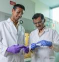 For years scientists have been working to fundamentally understand how nanoparticles move throughout the human body. One big unanswered question is how the shape of nanoparticles affects their entry into cells. Now researchers have discovered that under typical culture conditions, mammalian cells prefer disc-shaped nanoparticles over those shaped like rods. Krishnendu Roy (right) and Rachit Agarwal examine silicon wafers in their laboratory at Georgia Tech.